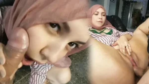 Cherry in pink hijab getting fucked on the couch with her legs spread wide